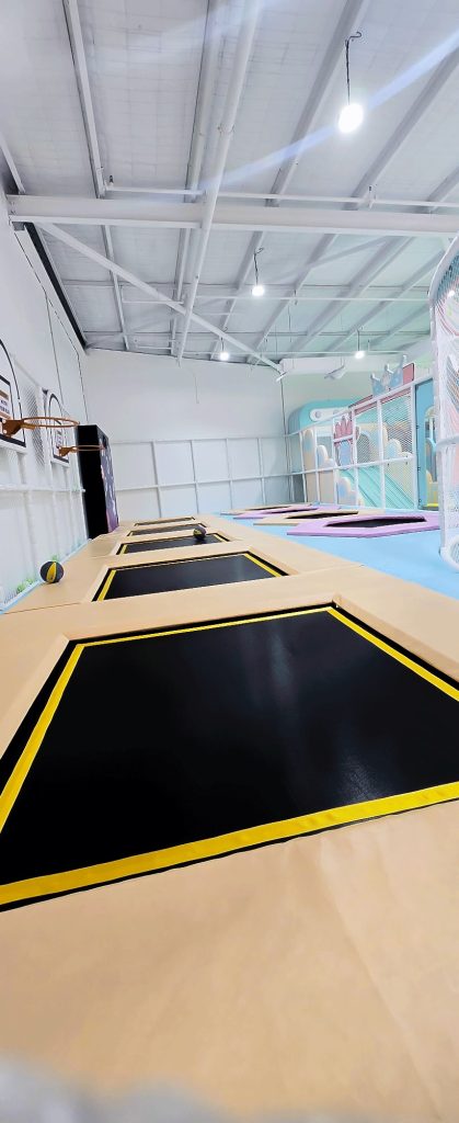 The trampoline lane at Kiddoz with basketball hoops